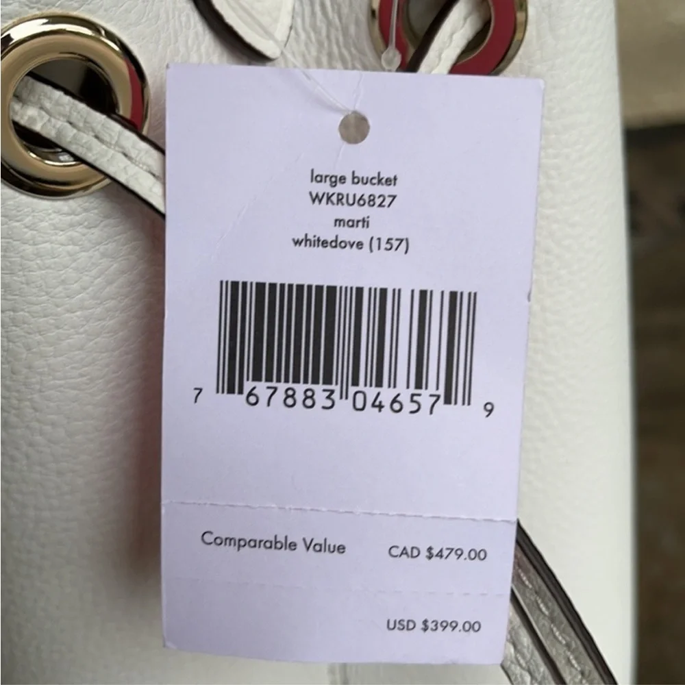 Kate Spade New York Marti large bucket bag in white pebbled leather.